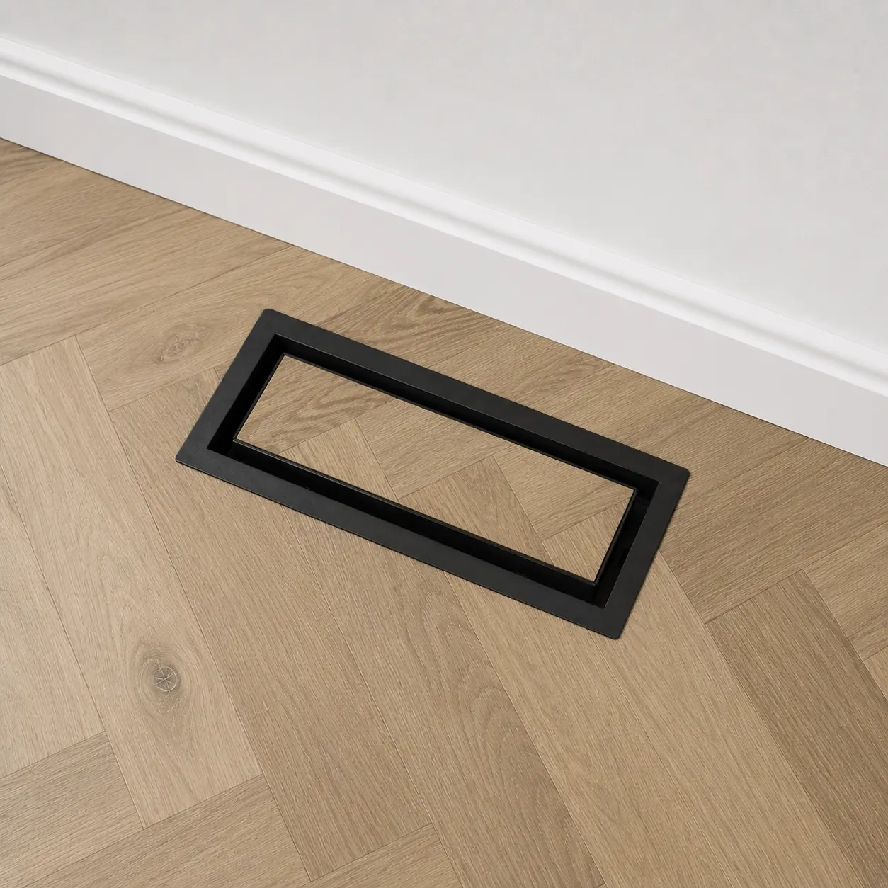 Black floor matching vent cover installed with matching flooring
