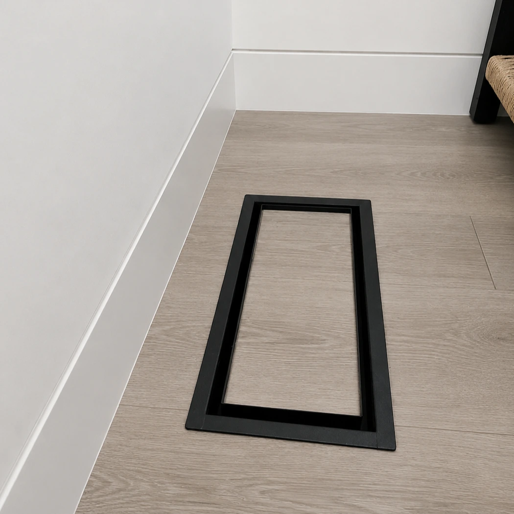 Large rectangular floor matching vent cover installed with flooring insert